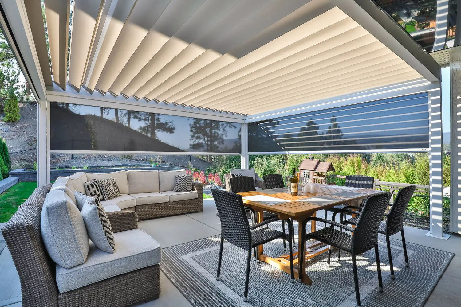 Corradi Alba louvered roof with retractable side screens and LED lighting over a patio