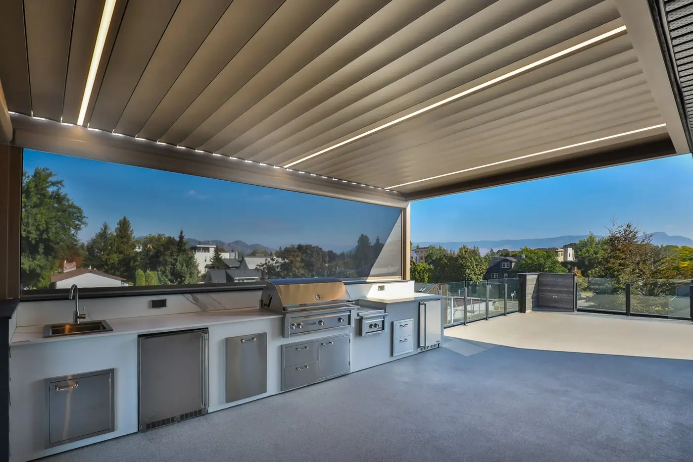 Alba louvered roof over an outdoor kitchen and seating area