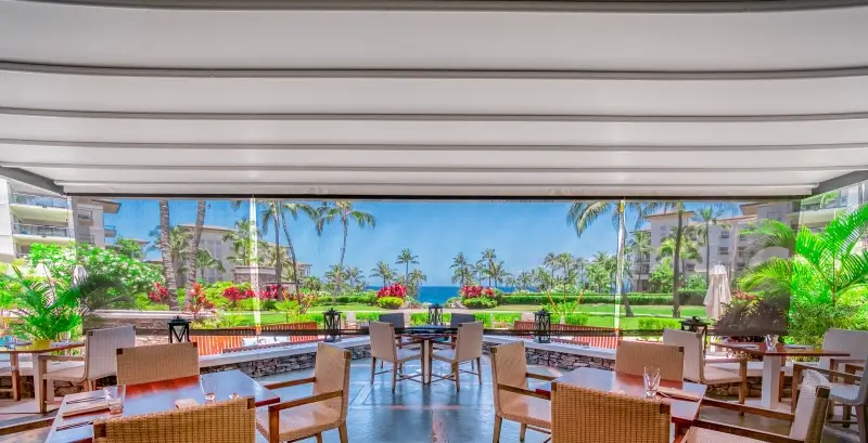 Corradi B-Space retractable pergola covering a large outdoor dining area