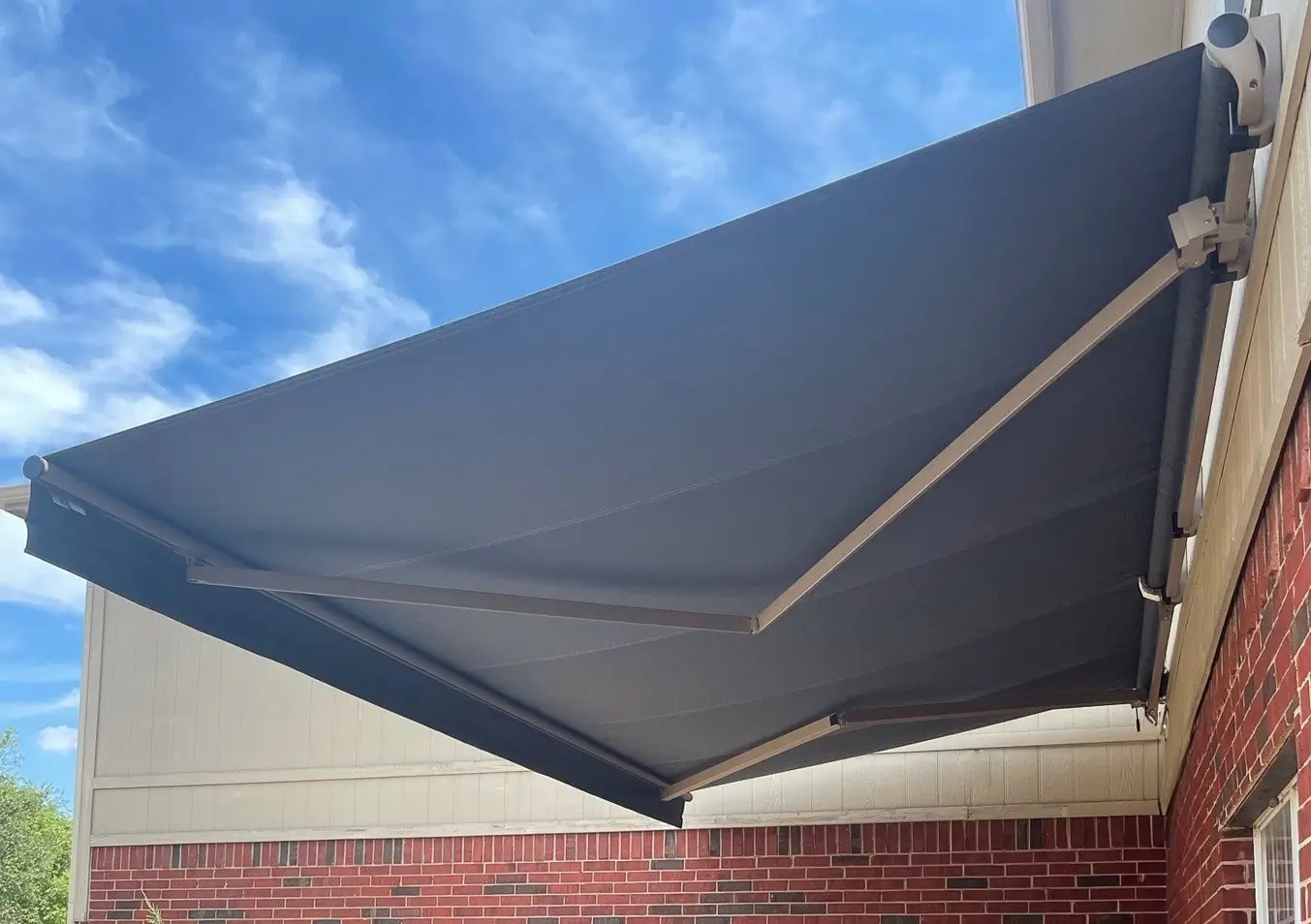 Corradi Klip open roll retractable awning on a house