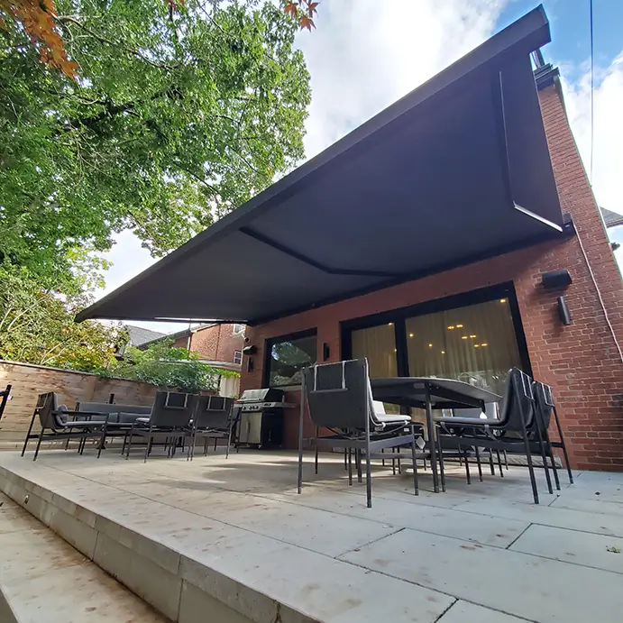 Corradi Shan square cassette awning extended over a patio